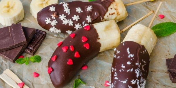 three chocolate covered bananas