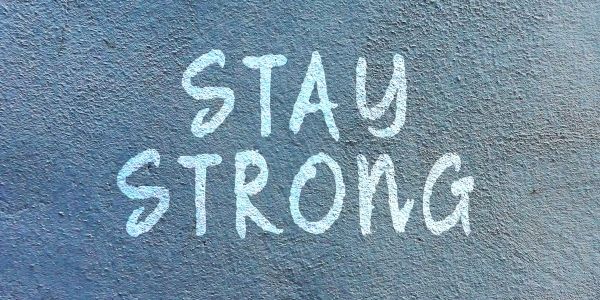 words stay strong painted on the wall