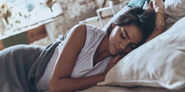 lady sleeping on bed