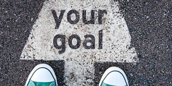 road with arrow saying your goal