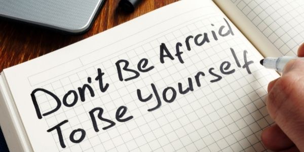 note book that says don't be afraid to be yourself