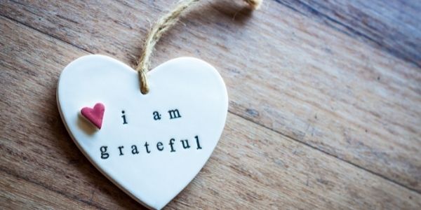 ceramic heart that says i am greateful