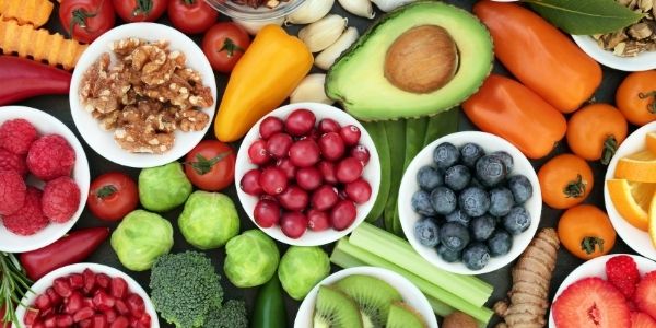 a large spread of whole foods fruits and vegetables