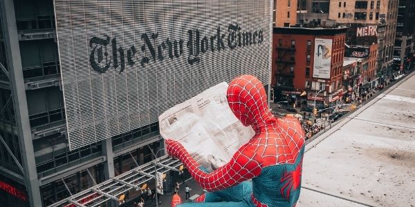 spiderman reading the paper