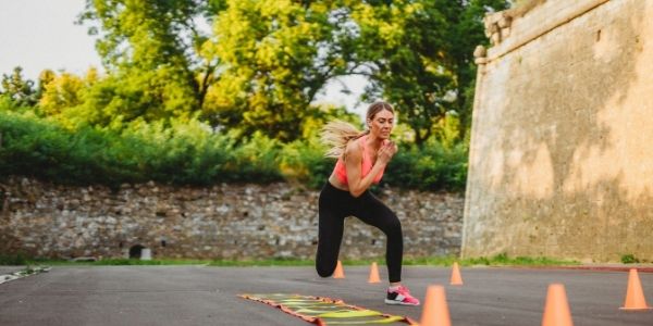 women doing tabata type drill exercises outside
