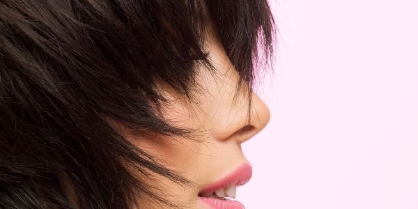 ladies face covered by blunt hair cut