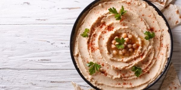 garnished bowl of hummus