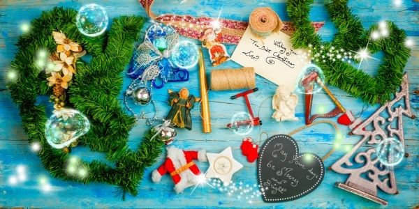 table full of christmas decorations and two christmas card messages