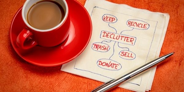 declutter list written on napkin sitting beside a coffee
