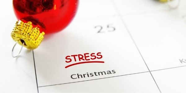 calendar zoomed in on the 25 with note saying stress christmas