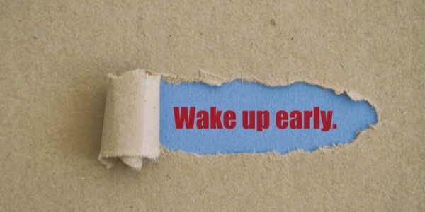 paper pealed back with note underneath saying wake up early