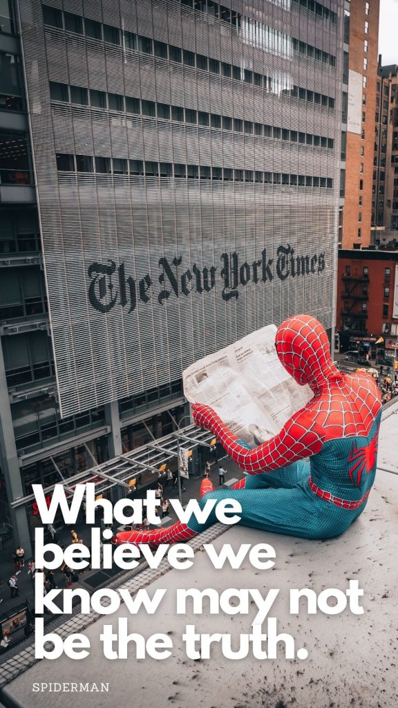 spiderman sitting on building across from the New York Times